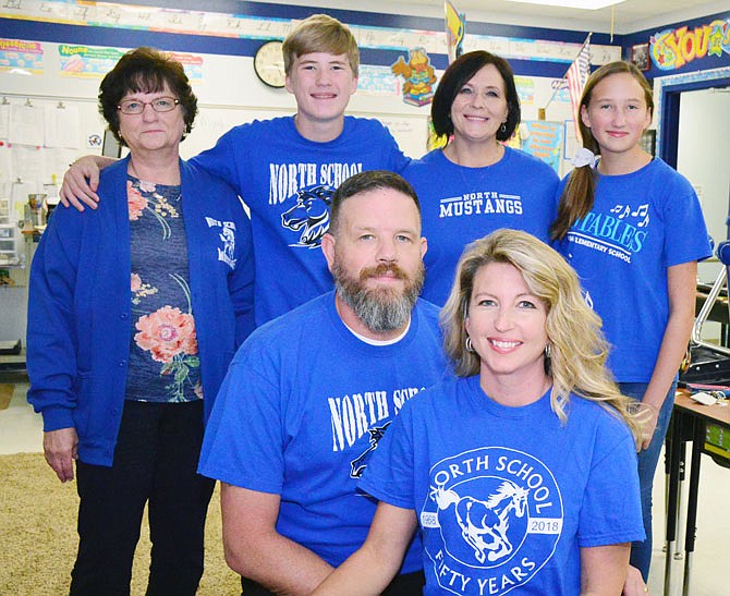 Bill and Julie Wood, foreground, and Sue Wood, son Bill, Gwen Welch and Cora, pose at North Elementary School in Holts Summit on Wednesday.