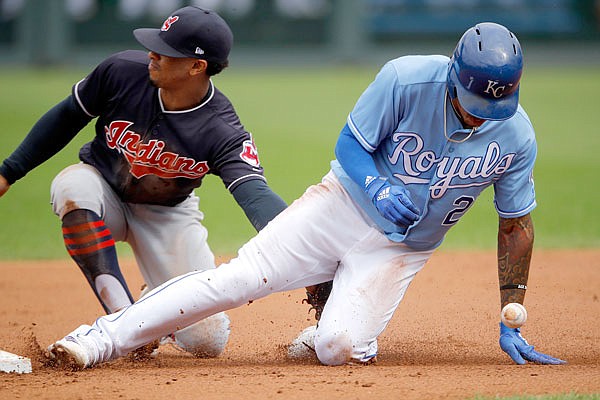 Adalberto Mondesi of the Royals beats the ball and the attempted tag by Indians shortstop Francisco Lindor to steal second during Sunday afternoon's game at Kauffman Stadium.