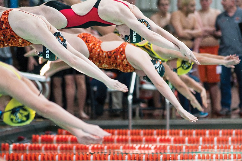 Swimmers start the 50-yard freestyle race Jan. 23, 2016 during the district championship held at Texarkana College.