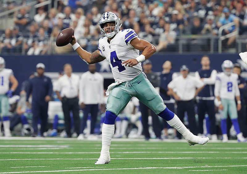 Dallas Cowboys quarterback Dak Prescott (4) passes in the second half against the Detroit Lions on Sunday in Arlington, Texas.