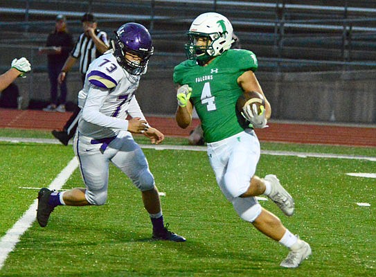 Blair Oaks' Jayden Purdy returns a kickoff past a Hallsville defender during last Friday night's game at the Falcon Athletic Complex in Wardsville.