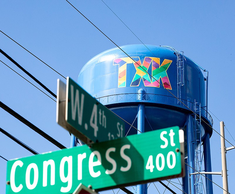 A Texarkana Water Utilities elevated water tank is pictured Wednesday near West Fourth and Congress streets in Texarkana, Texas. Nash, Texas, company Digital Effects Signs and Graphics installed two "TXK" logos, made of adhesive-backed vinyl. The cost was $5,000, paid from the city's general fund. The city owns the logo to use for purposes such as marketing.