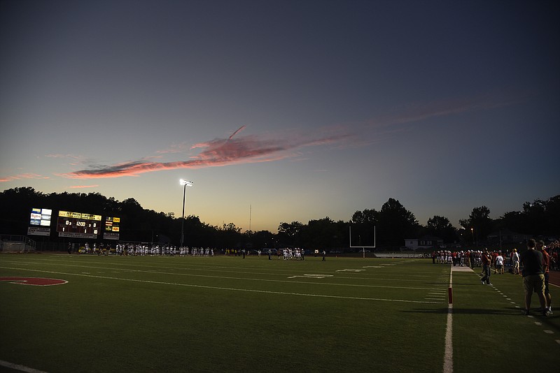 Players gather at the center of the football field for the coin toss on Friday, Oct. 5, 2018, as the Jefferson City Jays hosted DeSmet Jesuit at Adkins stadium.