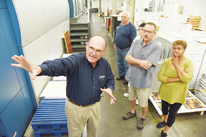 OCTOBER 2018 FILE: Command Web General Manager Chris Huckleberry, left, leads tours of the west end book printing plant as the Missouri Chamber of Commerce hosted an open house at the 230,000-square-foot facility. They did so in an effort to get students and young people interested in manufacturing. Officials offered numerous tours of the plant, hosting several dozen visitors. 