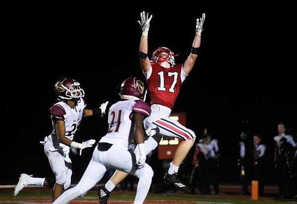 Ryan Brooks of Jefferson City reaches for a pass during Friday's game against De Smet at Adkins Stadium.