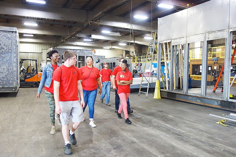 Members of Youth 180, a program to help young job seekers develop skills and find employment opportunities, tour AZZ Central Electric on Friday. Several tour participants expressed interest in applying to AZZ.