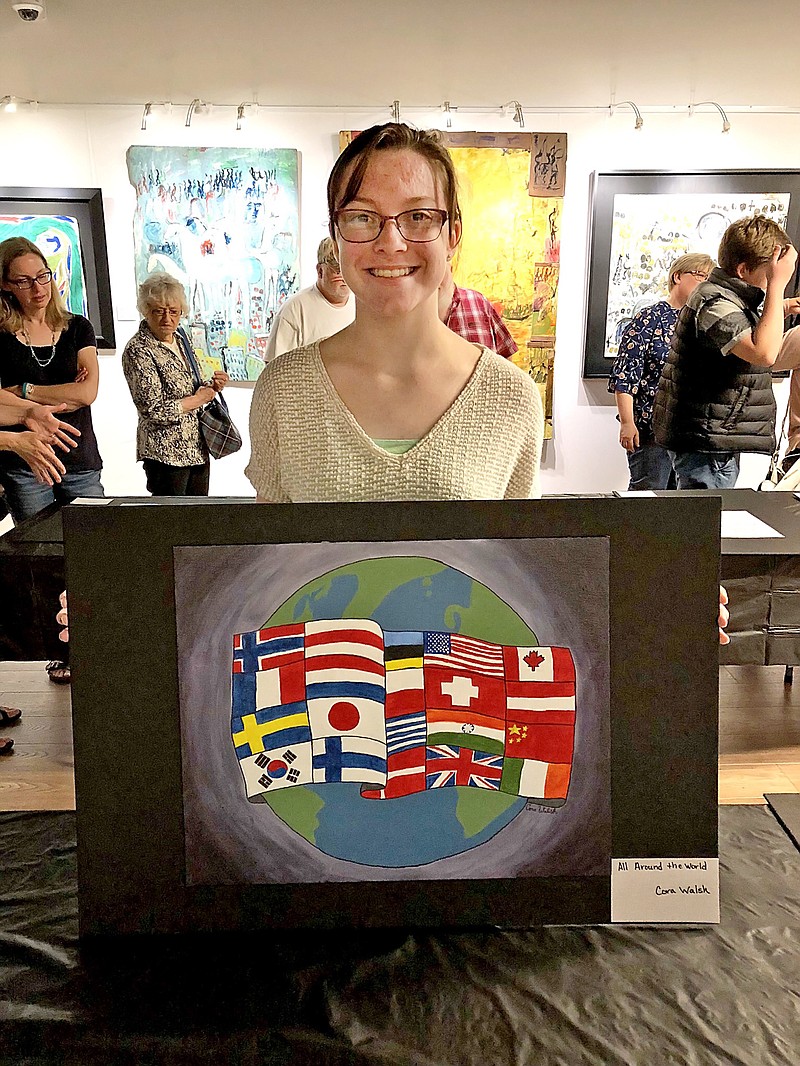 Sally Ince/ News Tribune 
First place winner Cora Walsh holds her art submission "All Around the World" Wednesday October 3, 2018 during a special exhibit for finalist at Jefferson City Museum of Modern Art. 