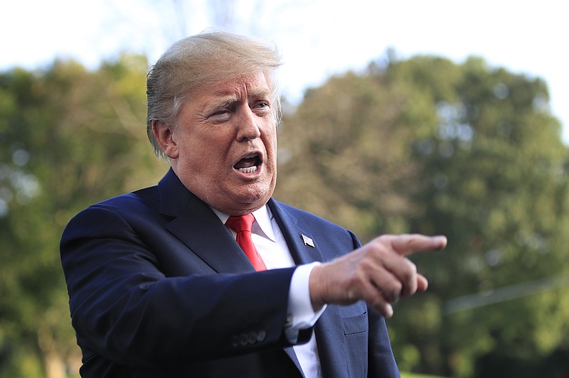 President Donald Trump speaks to reporters upon arrival at White House in Washington, Monday, Oct. 8, 2018, from a trip to Orlando, Fla. (AP Photo/Manuel Balce Ceneta)