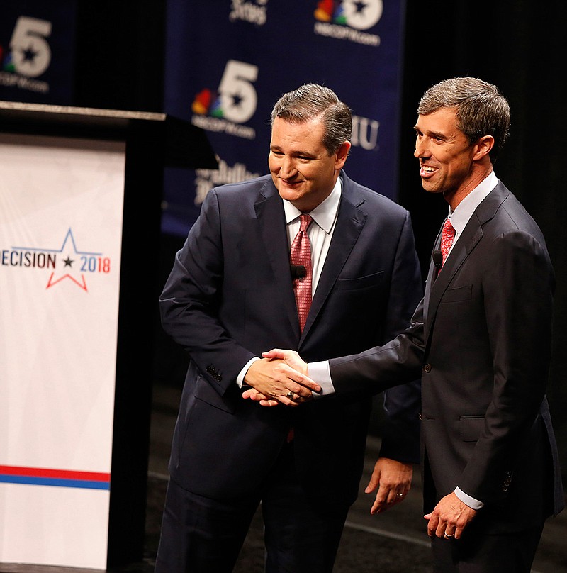 Sen. Ted Cruz (R-Texas) and Rep. Beto O'Rourke (D-Texas) shake hands after a debate on Sept. 21 at Southern Methodist University in Dallas. O'Rourke is challenging Cruz for his seat in the U.S. Senate. 