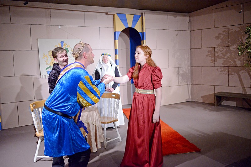 Sally Ince/ News Tribune 
Kevin Highfill, center left, playing the king, greets Lydia Bonnel, playing princess Philamena, Tuesday October 9, 2018 at Stained Glass Theatre. Showings of "That's- Princess with a pea!" will be at Stained Glass Theatre beginning Oct. 18. 