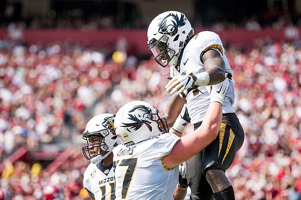 Missouri running back Larry Rountree III celebrates a touchdown with Paul Adams (77) during the first half of last Saturday's game against South Carolina in Columbia, S.C.