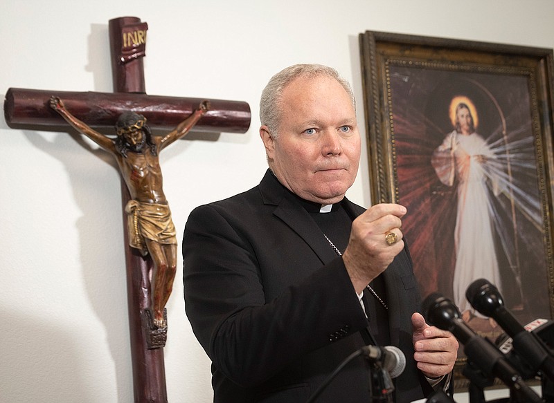 In this Aug. 19, 2018, file photo, Bishop Edward Burns addresses the media during a news conference at that St. Cecilia Catholic Church in Dallas. All 15 Catholic dioceses in Texas will release early next year the names of clergy who have been "credibly accused" of sexual abuse of a minor, the Diocese of Dallas said in a statement Wednesday, Oct. 10. (Rex C Curry/The Dallas Morning News via AP, File)