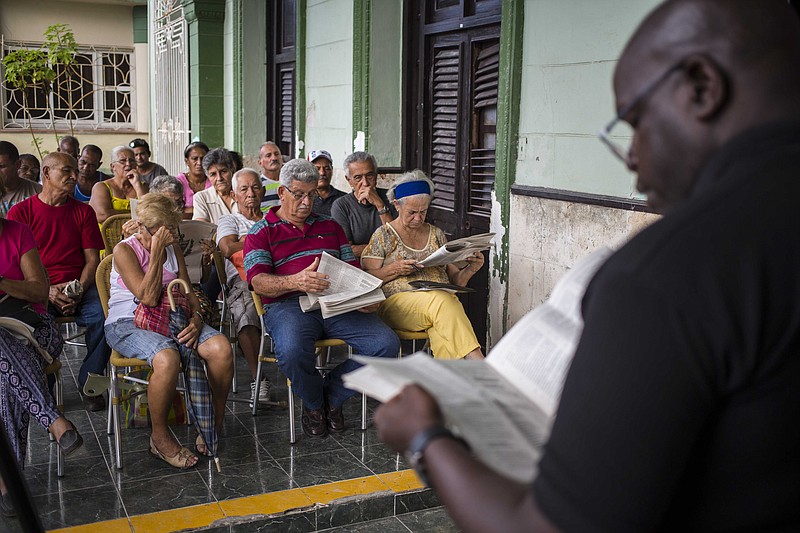 In this Sept. 30, 2018 photo, residents gather for a public forum on constitutional reform in Havana, Cuba. At a half-dozen public forums attended by Associated Press journalists this month, Cubans repeatedly called for direct election of the president and other officials, while many objected to allowing gays and lesbians to marry. (AP Photo/Desmond Boylan)