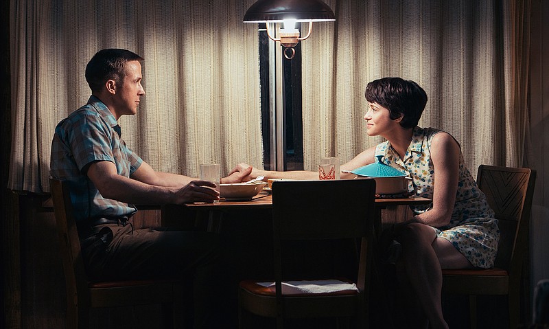 This image released by Universal Pictures shows Ryan Gosling, left, and Claire Foy in a scene from "First Man." (Daniel McFadden/Universal Pictures via AP)