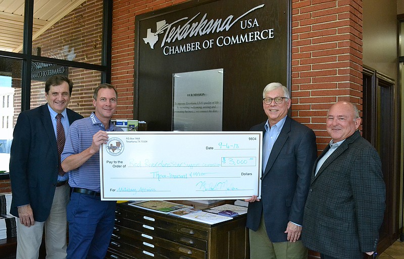 The Texarkana Chamber of Commerce donated $3,000 to the Red River Lone Star Support Committee, a nonprofit that assists the Red River Army Depot and other defense-related organizations with budget and workforce reductions and economic development opportunities. Pictured, from left, are chamber president and CEO Mike Malone, chamber Board of Directors chairman Mark Van Herpen, and Red River Lone Star Support Committee members Jerry Sparks and Dennis Lewis. (Submitted photo)
