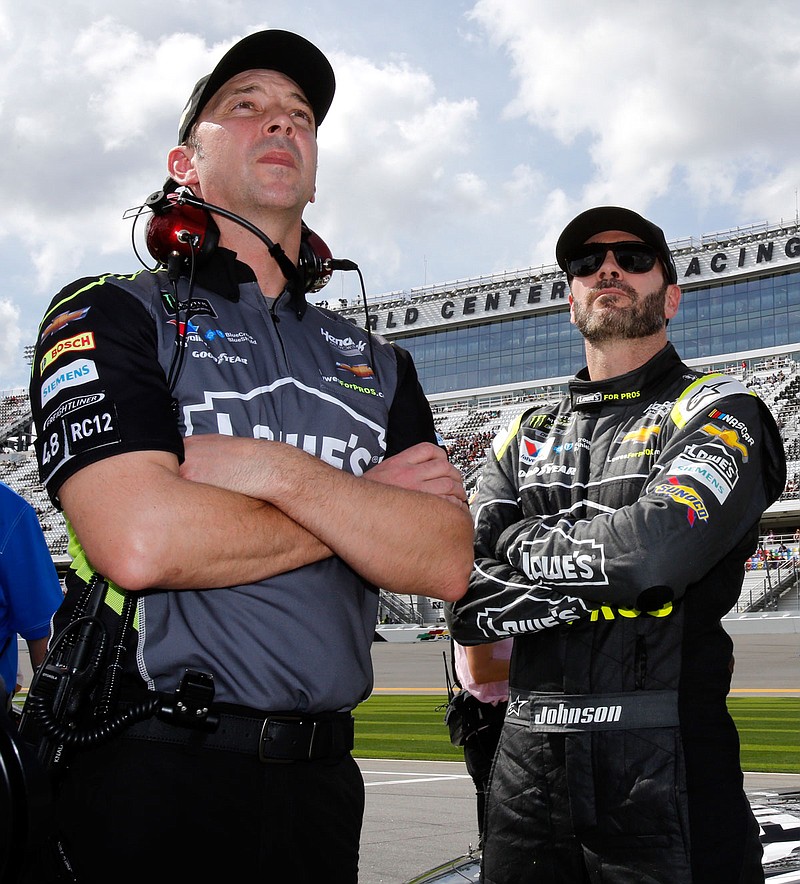 In this Feb. 11 file photo, crew chief Chad Knaus (left) and Jimmie Johnson watch the leaderboard during qualifying for the Daytona 500 at Daytona International Speedway in Daytona Beach, Fla. Hendrick Motorsports announced Wednesday Knaus will be William Byron's crew chief next season.