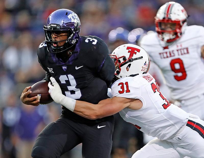 Texas Tech's Justus Parker (31) forces a fumble on TCU's Shawn Robinson (3) during the first half of an NCAA college football game Thursday, Oct. 11, 2018, in Fort Worth, Texas. (Brad Tollefson/Lubbock Avalanche-Journal via AP)