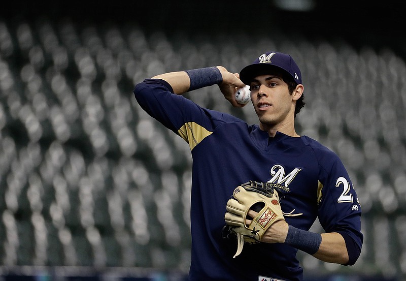 Milwaukee Brewers' Christian Yelich warms up for practice for Game 1 of the National League Championship Series baseball game Los Angeles Dodgers Thursday, Oct. 11, 2018, in Milwaukee. (AP Photo/Matt Slocum)