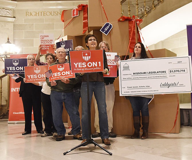 Christine Doerr, of Columbia, addresses reporters Friday, Oct. 12, 2018, in the state Capitol Rotunda as she and other "Clean Missouri" supporters held a rally in support of proposed Amendment 1.