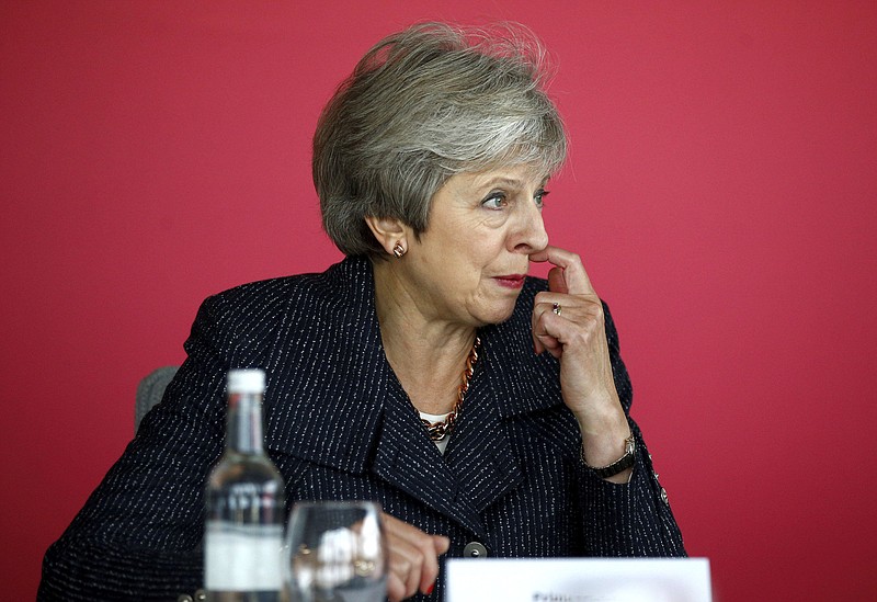 Britain's Prime Minister Theresa May attends a roundtable meeting with business leaders whose companies are inaugural signatories of the Race at Work Charter at the Southbank Centre in London, Thursday Oct. 11, 2018. (Henry Nicholls/Pool via AP)