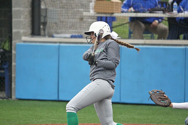 Erin Fennewald of Blair Oaks follows through as she watches her three-run home run in the bottom of the fifth inning of Saturday's game against Fatima in the Class 2 District 9 Tournament championship game at Mokane.