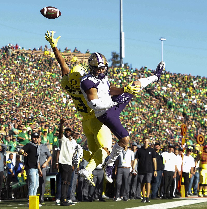 Washington defensive back Byron Murphy (1), breaks up a pass intended for Oregon wide receiver Johnny Johnson III (3), during an NCAA college football game in Eugene, Ore., Saturday, Oct. 13, 2018. (AP Photo/Thomas Boyd)