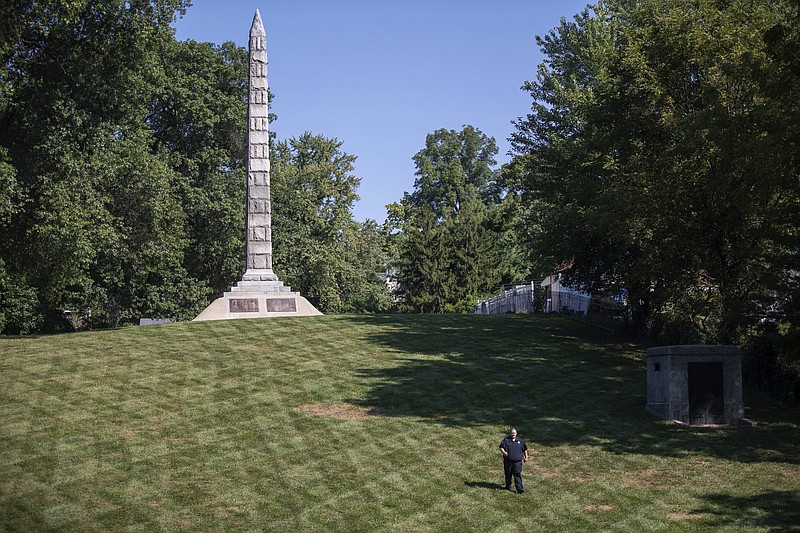 In this photo made Wednesday, Sept. 19, 2018, a security guard walks the grounds at North Alton Confederate Cemetery in Alton, Ill. The federal government has hired private security firms to guard several Confederate memorials across the U.S in the aftermath of clashes between white nationalists and counter-protesters last year. Information obtained by The Associated Press shows that nearly $3 million has been spent on contracted security since last summer and another $1.6 million is budgeted for similar protection in fiscal 2019. (AP Photo/Jeff Roberson)