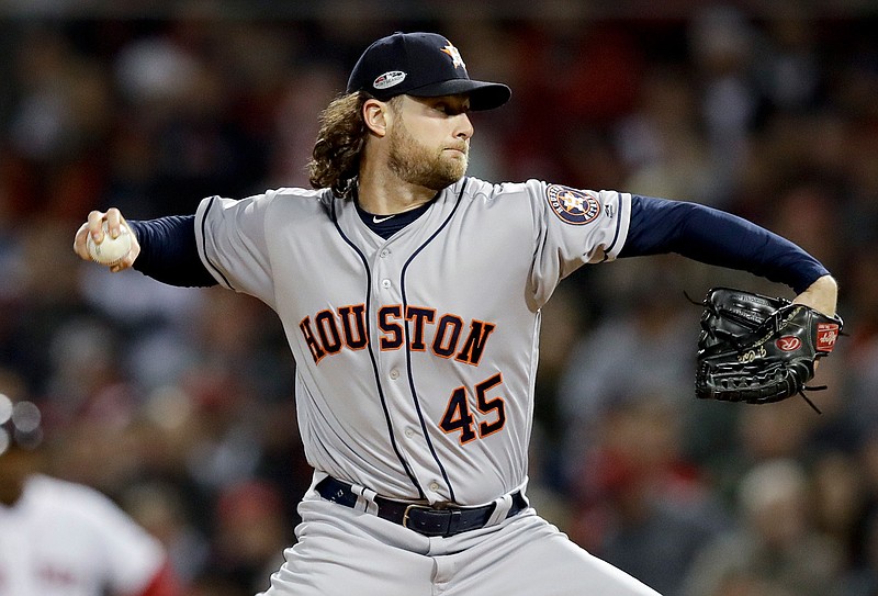 Houston Astros starting pitcher Gerrit Cole throws against the Boston Red Sox during the first inning in Game 2 of a baseball American League Championship Series on Sunday, Oct. 14, 2018, in Boston. (AP Photo/Charles Krupa)