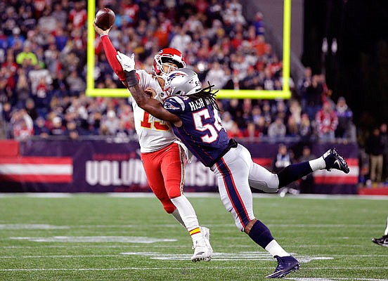 Chiefs quarterback Patrick Mahomes is pressured by Patriots linebacker Dont'a Hightower during Sunday night's game in Foxborough, Mass.