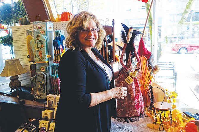 Virginia McCoskrie, owner of Smockingbirds, has learned to decorate her shop windows over time. Her Halloween windows are spooktacular.