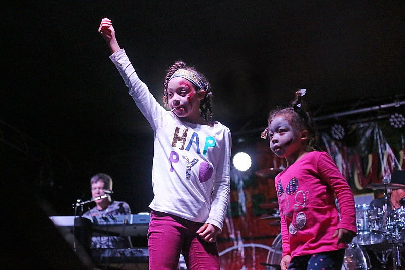 Alaya Johnson, 7, left, and her sister Cayden Johnson, 3, dance onstage during Zombie Night Live held in downtown Jefferson City on Thursday, October 26, 2017. 