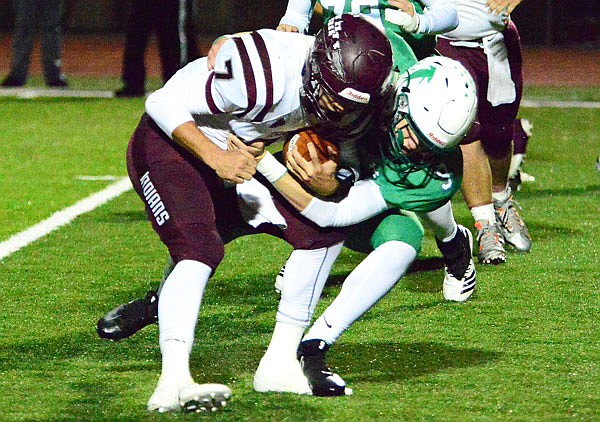 Blair Oaks sophomore linebacker Cade Stockman wraps up School of the Osage quarterback Dalton Depee for a tackle during last Friday's game at the Falcon Athletic Complex in Wardsville.