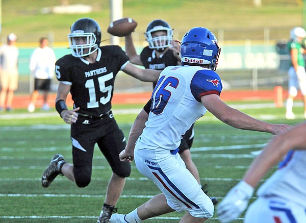 California senior Alex Meisenheimer (16) watches the Centralia quarterback attempt a pass during the Blair Oaks Jamboree earlier this season at the Falcon Athletic Complex in Wardsville.