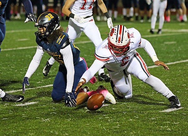 Jays quarterback Devin Roberson falls on a fumble during last Friday night's game against Battle in Columbia.