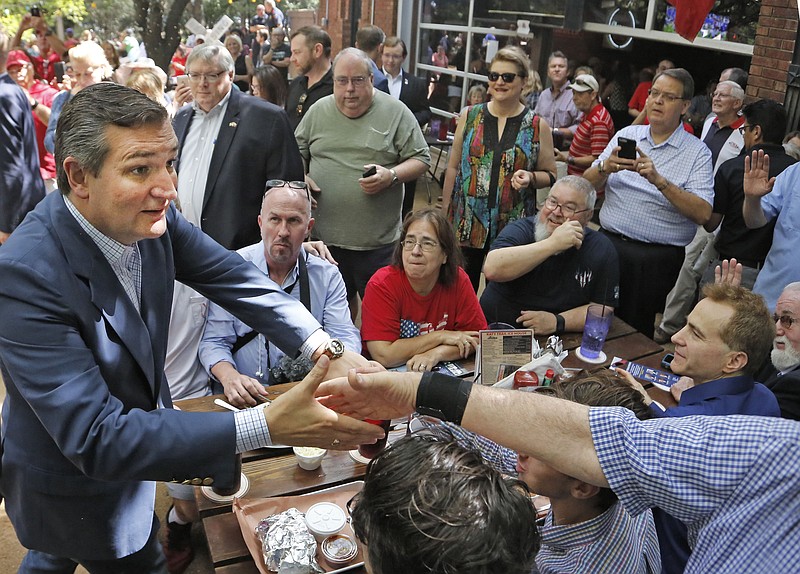 Sen. Ted Cruz works the crowd as he campaigns at the Katy Trail Ice House Outpost in Plano, Texas, photographed on Thursday, Oct. 4, 2018. (Louis DeLuca/The Dallas Morning News/TNS) 