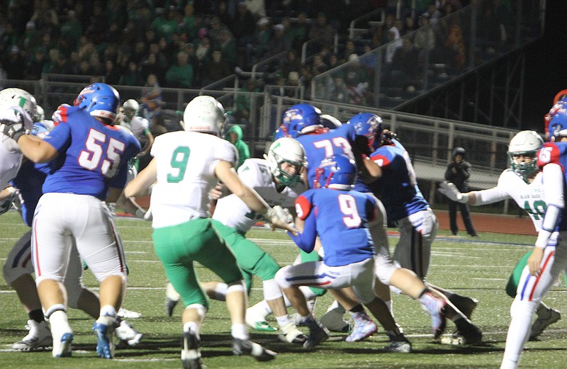 Calen Kruger attempts to squeeze past Blair Oak defenders Oct. 19, 2018, during California's 65-7 loss to Blair Oaks.