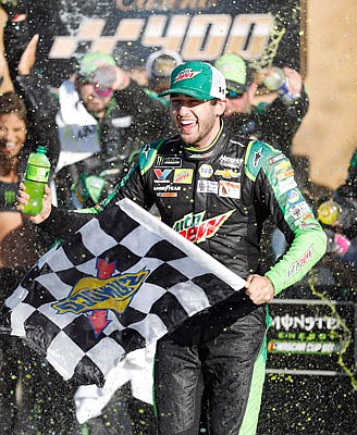 Chase Elliott celebrates Sunday after winning the NASCAR Cup Series race at Kansas Speedway in Kansas City, Kan.