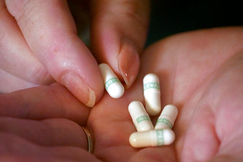 Bridgett Snelten holds her medication on July 11 at her home, in Sandy, Utah. Snelten has diabetes and has had to change health insurance plans three years in a row.   

