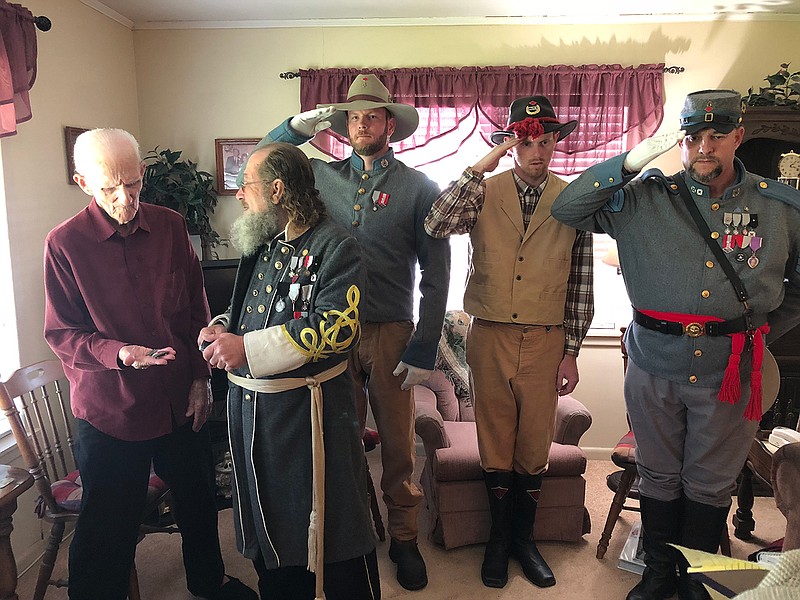 Phil Maynard, commander of the Texarkana, Texas-based Sons of Confederate Veterans' Red Diamond Camp 2193, presents a Confederate Grandson's Medal to New Boston resident Doyle Steve Barfield during a Sunday afternoon, Oct. 21, 2018, ceremony at Barfield's home. Barfield, 93, is one of very few grandchildren of Confederate Civil War military veterans still living.