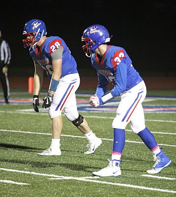 California senior Trystan Hees (left) and freshman Trevor Myers line up for an offensive play from scrimmage during last Friday's game against Blair Oaks at California.