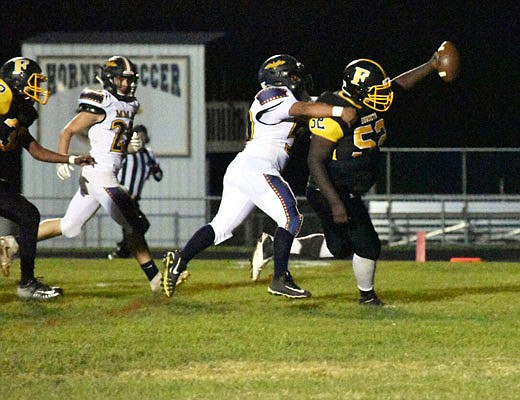 Fulton defensive tackle Emarieon Clark returns a fumble for a touchdown during last Friday night's game against Missouri Military Academy in Fulton.