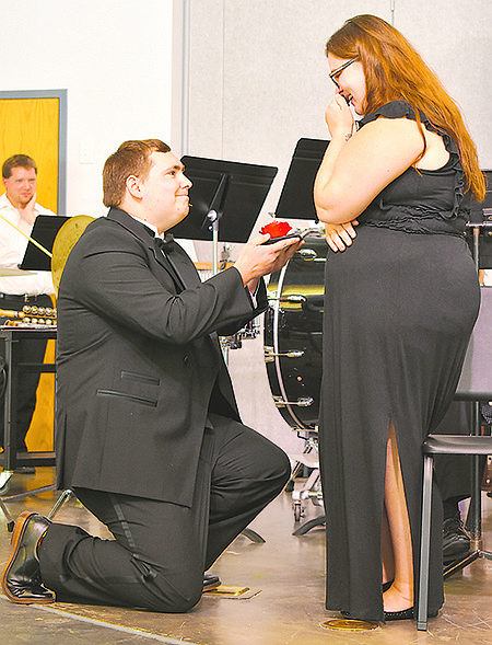 Joe Schneider proposes to his girlfriend, Casey McDonald, at the end of Sunday's Jefferson City Community Symphonic Band concert at Calvary Lutheran High School.