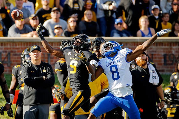 Missouri receiver Jalen Knox can't reach a pass while being defended by Kentucky cornerback Derrick Baity Jr. during the first half of Saturday's game at Faurot Field.