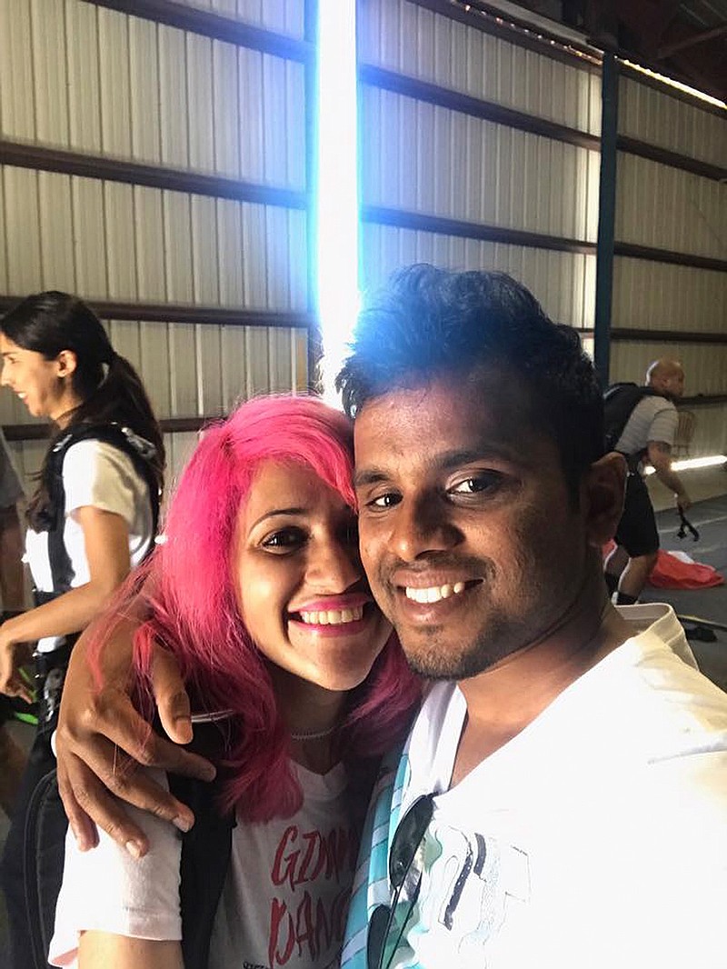 This photo obtained from Facebook posted on June 26, 2017, shows a selfie of Vishnu Viswanath, right, and his wife Meenakshi Moorthy at Skydive Santa Barbara in Lompoc, Calif. The Indian husband and wife who fell to their deaths from Taft Point, a popular overlook at Yosemite National Park, were apparently taking a selfie, the man's brother said Tuesday, Oct. 30, 2018. (Vishnu Viswanath/Facebook via AP)