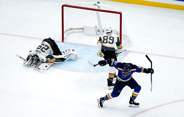 Tyler Bozak of the Blues celebrates after scoring past Golden Knights goaltender Marc-Andre Fleury (left) and Alex Tuch (89) during the third period of Thursday's game in St. Louis.