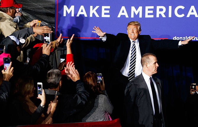 President Donald Trump arrives to speak Thursday at a campaign rally at Columbia Regional Airport in Columbia.