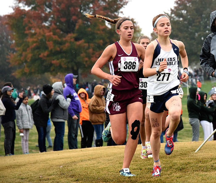 Helias freshman Alexa Lamb (front) runs during the Class 3 girls race on Saturday, Nov. 3, 2018, at the cross country state meet. The Missouri High School Cross Country State Championships were held at Oak Hills Golf Center.
