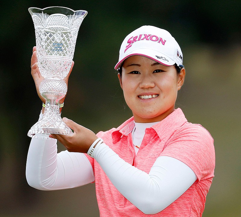 Japan's Nasa Hataoka poses with trophy after winning the Japan Classic golf tournament in Shiga, Japan Sunday, Nov. 4, 2018. (Ichiro Sakano/Kyodo News via AP)