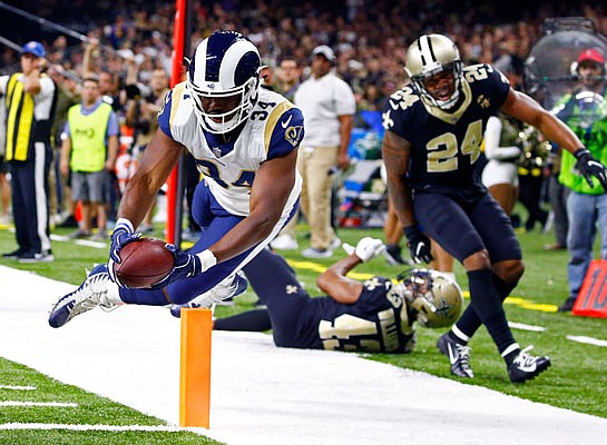 Rams running back Malcolm Brown scores a touchdown in front of Saints free safety Marcus Williams and strong safety Vonn Bell in the second half of Sunday afternoon's game in New Orleans.