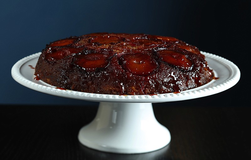 Caramelized sugar glazes the top of a cake studded with halved black plums. (Abel Uribe/Chicago Tribune/TNS) 